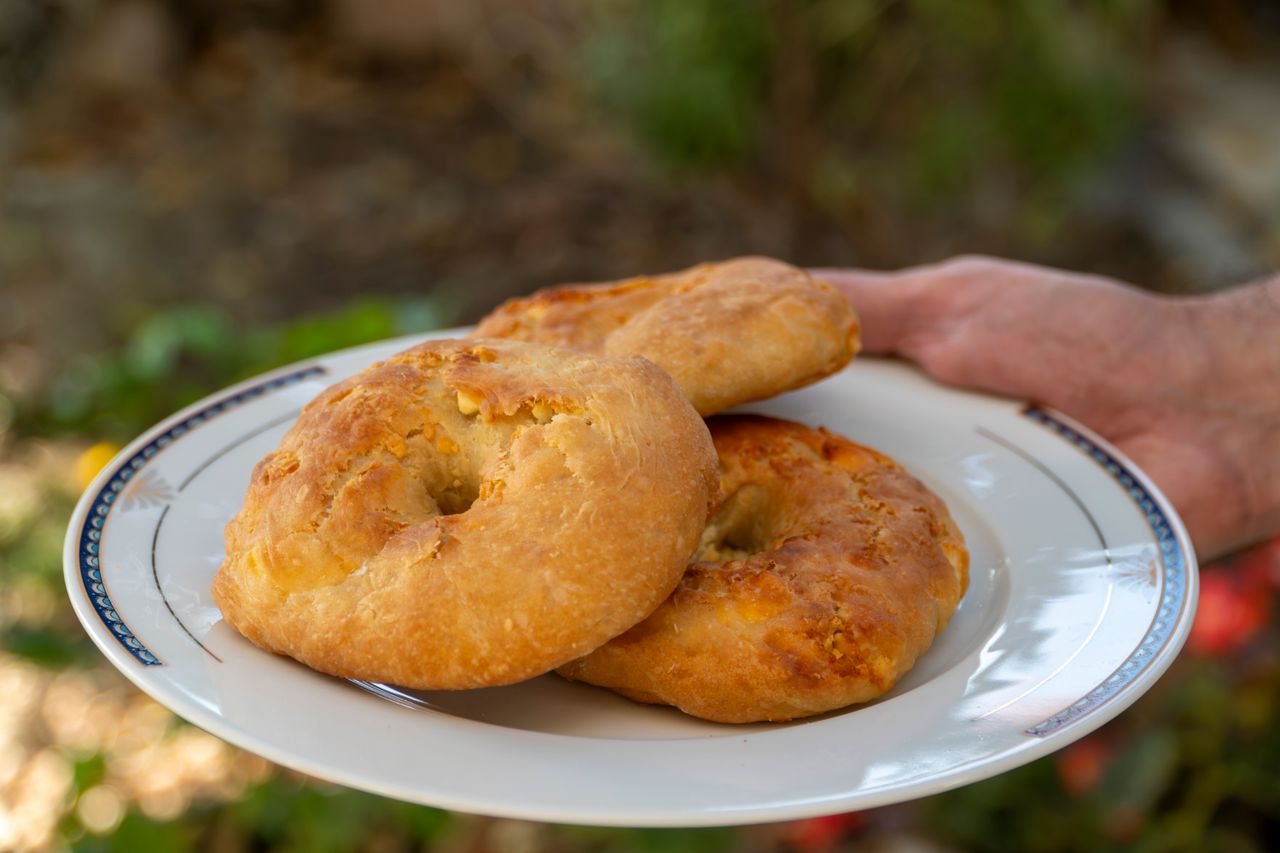 services-02 Traditional Greek tiganopsomo served on a plate, showcasing delicious homemade Greek fried bread.